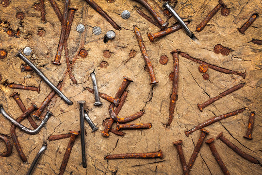 Old rusted and new nails in a trunk