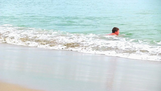 Boy playing in the water