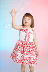 Child playing with soap bubbles