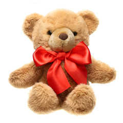 Classic teddy bear with red bow isolated on white background