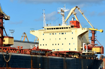 cargo ship loading in cargo terminal
