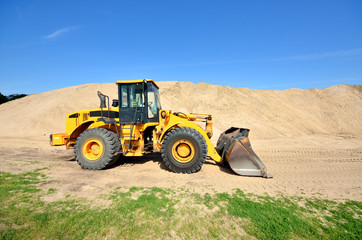 bulldozer working in sand dunes © Alex Stemmer