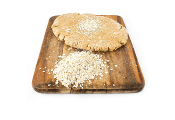 Raw ball of dough on wooden board  on white background