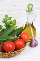 Vegetables and a bottle of olive oil