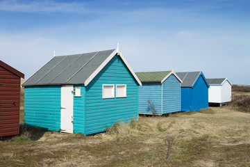 Fototapeta na wymiar A Row Of Colorful Beach Huts, Hunstanton, Norfolk, UK.