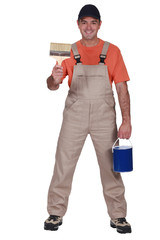 Happy decorator with brush and pot