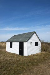 Fototapeta na wymiar Black and White Beach Hut at Hunstanton, Norfolk, UK.