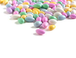 Jordan Almonds in glass vase isolated on white background
