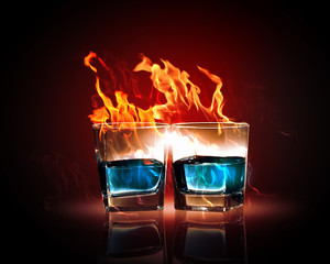 Two glasses of burning emerald absinthe