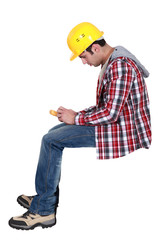 Tradesman holding a multimeter