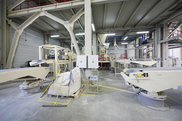 Conveyors in workshop at factory