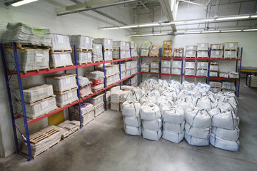 Small warehouse with lot of big white sacks