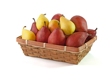 Yellow and vinous pears in the basket isolated on white