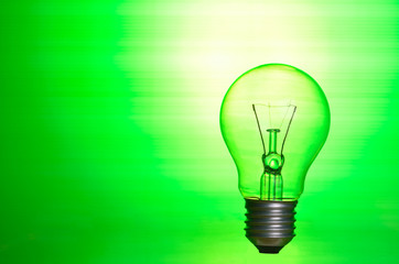 Lamp over green background