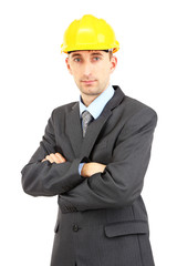 Young businessman in helmet isolated on white.