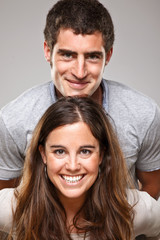 Obraz premium Portrait of a beautiful young happy smiling couple