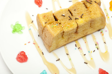 Bread topped with honey isolated on white background