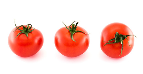 Three fresh tomatos isolated over white