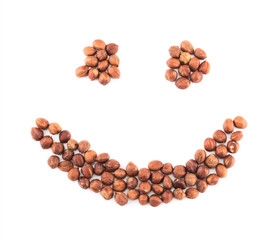 Smile shape made of hazelnuts isolated