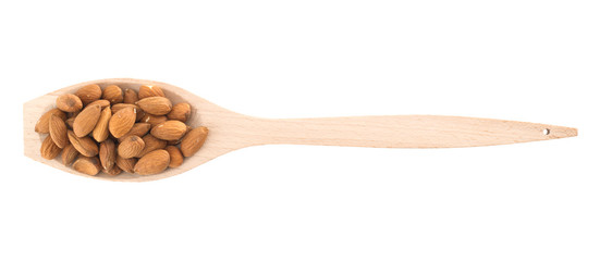 Spoon full of almonds isolated