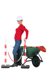 Road-side worker with wheelbarrow