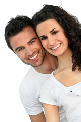 Obraz premium Cheerful couple in front of blue wall