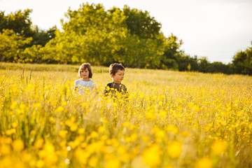 Brother and sister in a field