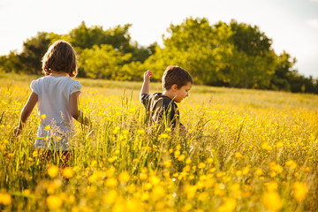 Brother and sister in a field