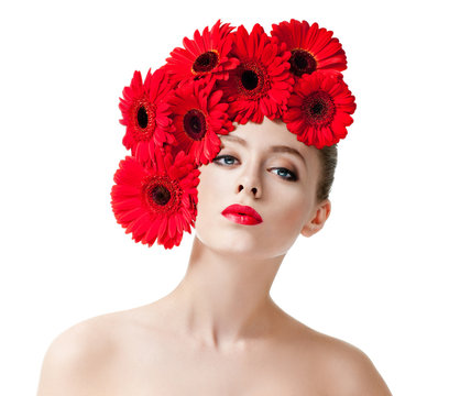 fashion model with hairstyle and red flowers in her hair.