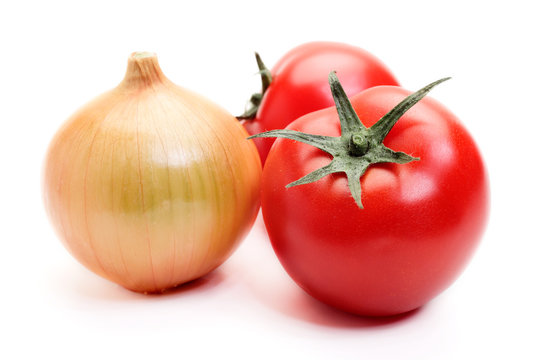 Tomatoes and onion on white background