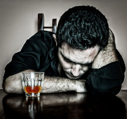 Grunge portrait of a lonely and desperate drunk  man