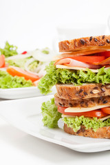 Ham and cheese sandwiches on plate