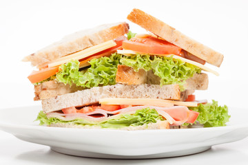Ham and cheese sandwiches on plate
