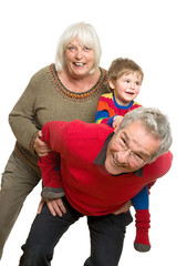 Grandparents with Grandchild on White Background - Having Fun