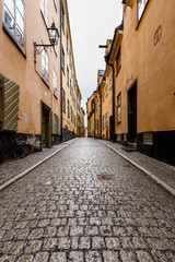 Fototapeta premium Narrow Street in Old Town (Gamla Stan) of Stockholm, Sweden
