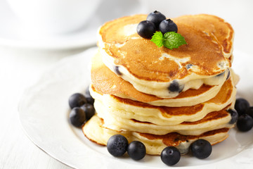 Stack of pancakes with fresh blueberry