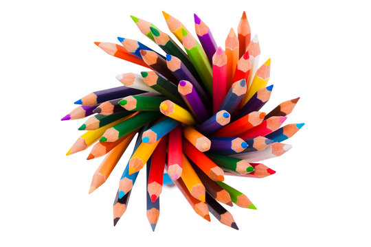 Spiral of color pencils on white background