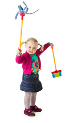 Infant girl child with a broom