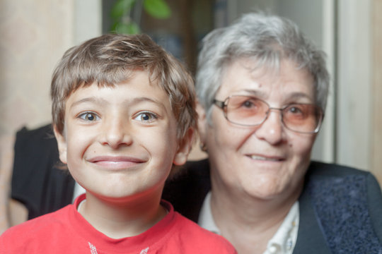 portrait of a senior woman and grandson