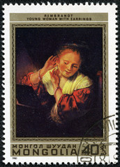 Stamp shows the "Woman Trying on Earrings", by Rembrandt