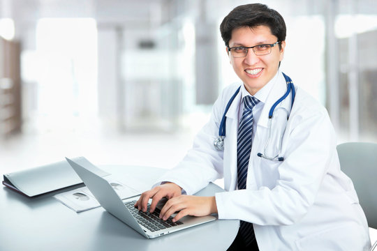 Medical doctor working with laptop