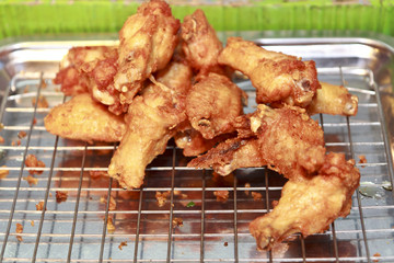 Fried chicken legs on the grill.