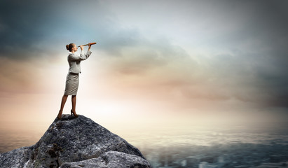 Business woman with telescope