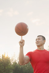 Athletic Man Spinning Basketball
