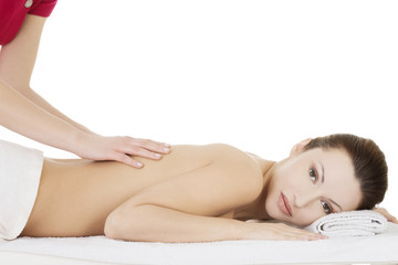 Fototapeta na wymiar Preaty woman relaxing beeing massaged in spa