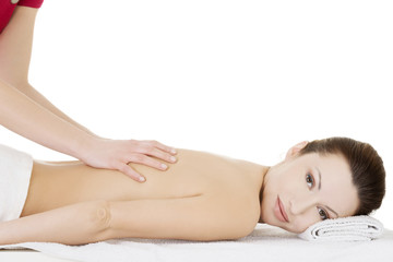 Obraz na płótnie Canvas Preaty woman relaxing beeing massaged in spa