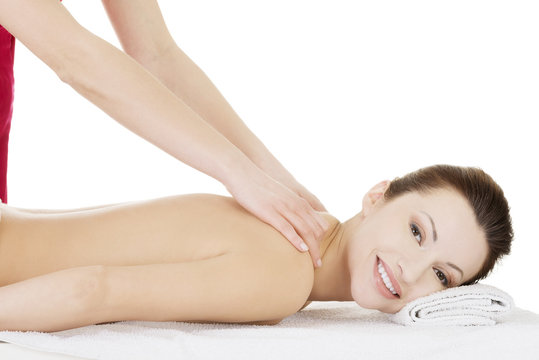 Preaty woman relaxing beeing massaged in spa