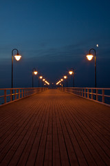 Sunrise on the pier at the seaside, Gdynia Orlowo, Poland.