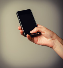 Mobile phone in the hands of a girl