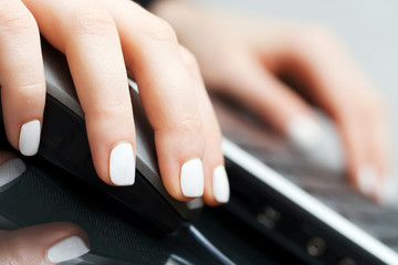 Female hands using computer mouse